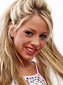 Cute blonde amateur teen posing on the couch