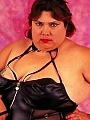 Dominatrix BBW in Black Suit Posing with Whip