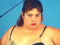 Huge Belly Fat Babe in Dominatrix Look Posing