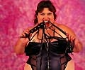 Dominatrix Looking Fat Chick Posing with Whip