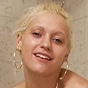 Horny blond girl dildoing her twat in bathing